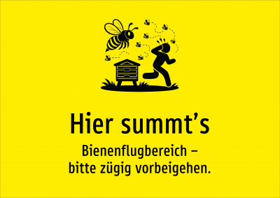 Hier summt’s - Bienenflugbereich – bitte zügig vorbeigehen.