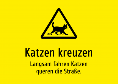 Katzen kreuzen - Langsam fahren Katzen queren die Straße.