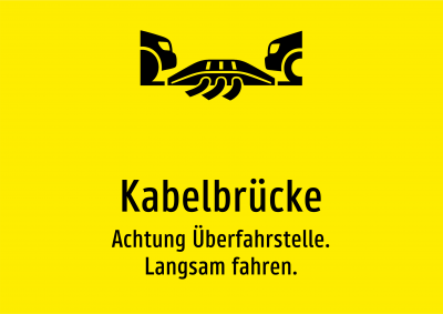 Kabelbrücke - Achtung Überfahrstelle. Langsam fahren.