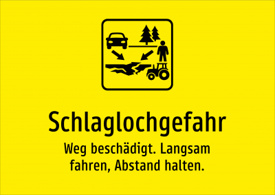 Schlaglochgefahr - Weg beschädigt. Langsam fahren, Abstand halten.