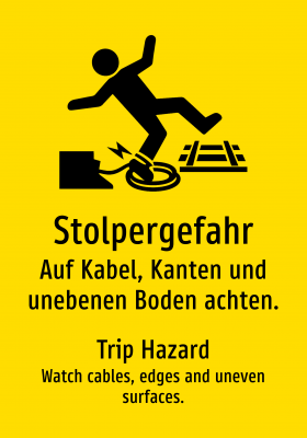 Stolpergefahr - Auf Kabel, Kanten und unebenen Boden achten.
